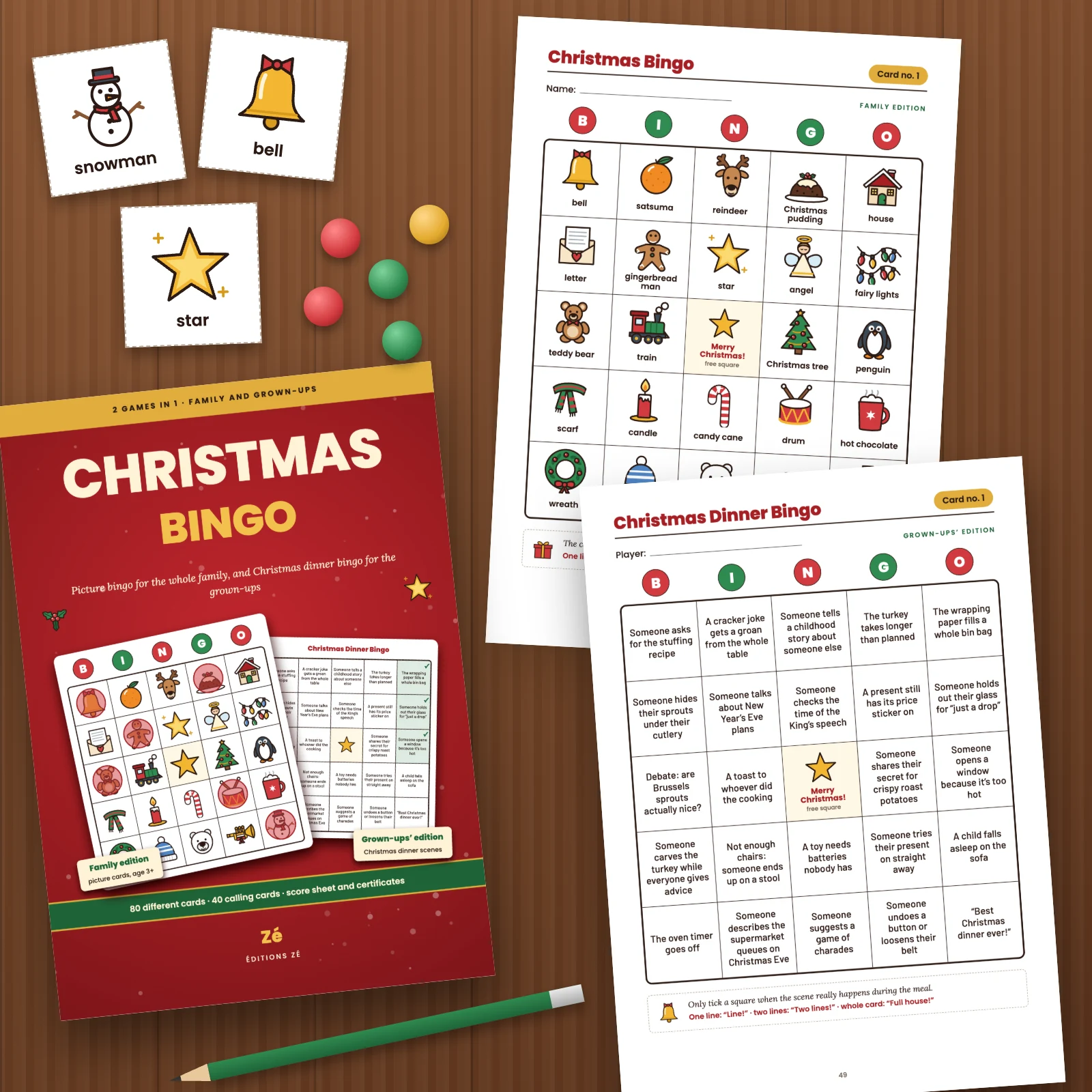 The cover and two printed pages from the PDF on a wooden table: family picture card no. 1 and Christmas dinner card no. 1, with three cut-out calling cards (snowman, bell, star), counters and a pencil