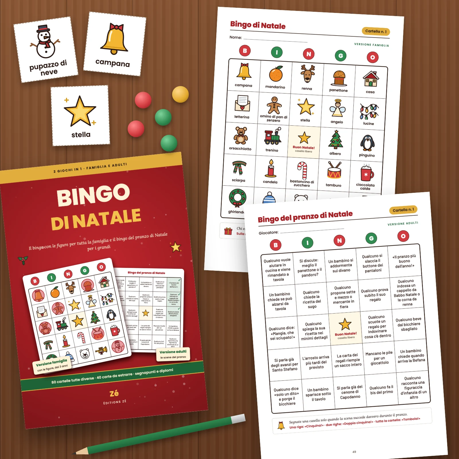La copertina e due pagine stampate del PDF su un tavolo di legno: la cartella famiglia n. 1 con le figure e la cartella n. 1 del bingo del pranzo di Natale, con tre carte ritagliate (pupazzo di neve, campana, stella), gettoni e una matita