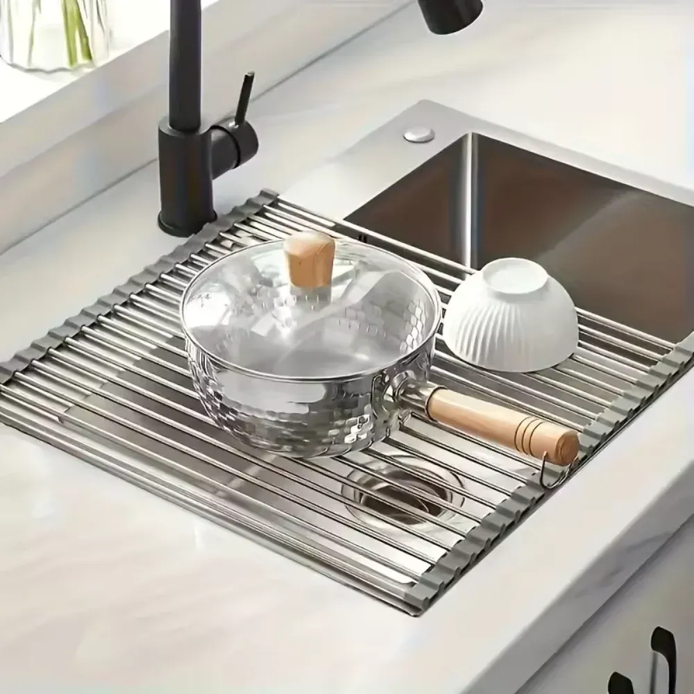 Saucepan and bowl resting on the rack over the sink